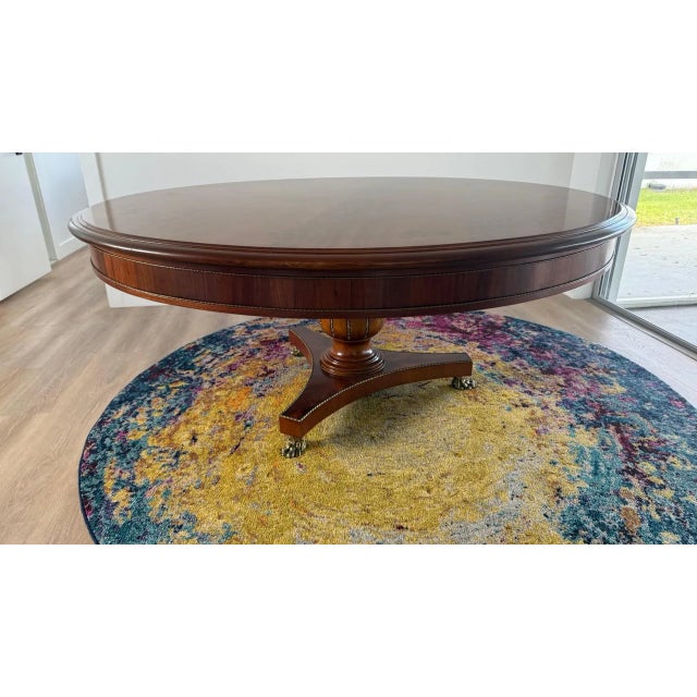 A showstopping 72-inch round dining table by La Maison Élégante Pour Les Meubles Français, designed with all the grandeur...