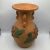 Super cool vintage Terra-cotta hand thrown vessel with three handles and raised floral design. The vessel has hand scribed...