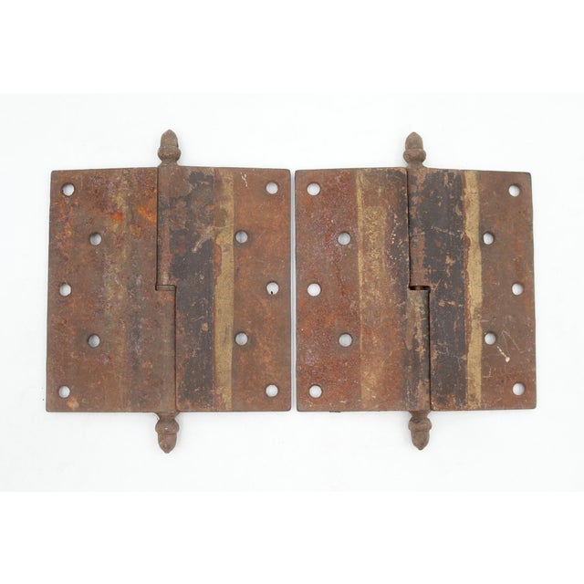 These right hand door hinges are made of cast iron with acorn tips, a lift off knuckle, and a staggered hole pattern. The...