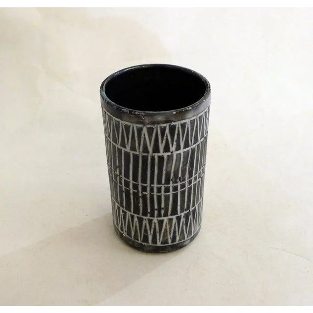 Small mid-century roll vase, straight cylindrical body, in earthenware with a matte black glaze, decorated with geometric...
