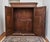 A solid oak wardrobe from the early 19th century, made using traditional craftsmanship. The front is decorated with...