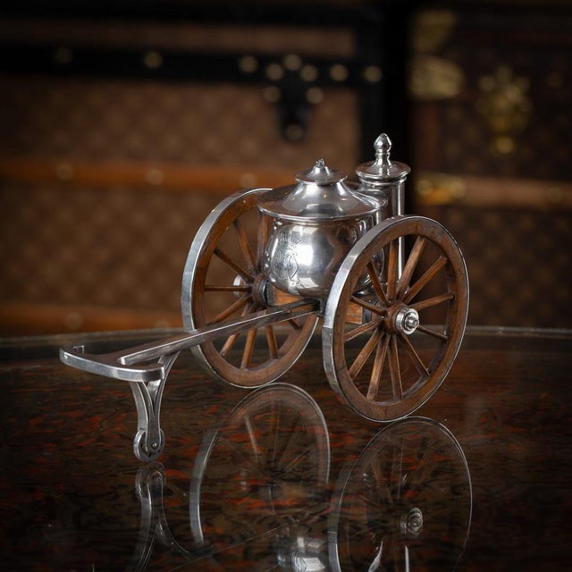 Antique 19th century victorian solid silver table lighter, crafted in the form of a fire wagon with silver-rimmed...