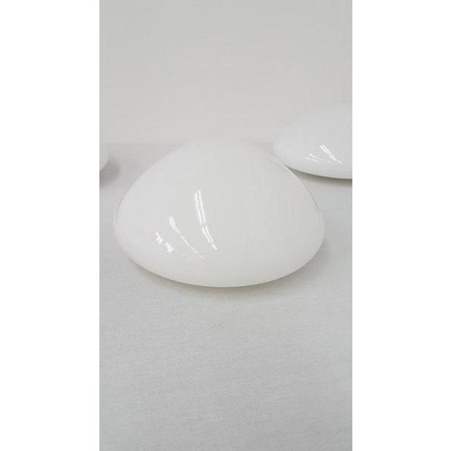 These vintage round ceiling lamps are made of a porcelain ceiling mount and have a white opal glass lampshade. They can be...