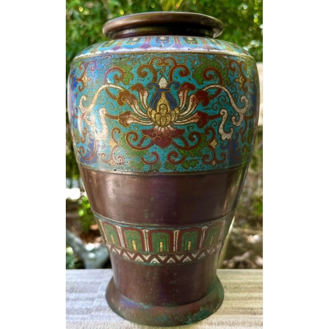 This beautiful 18th-century Chinese cloisonné enamel bronze vase is a fine example of Qing dynasty decorative arts. The...