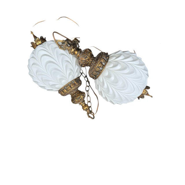 1960’s Hollywood Regency, swag lamps. This pair of lookers are made of milk glass with gilded gold top and bottom. They...