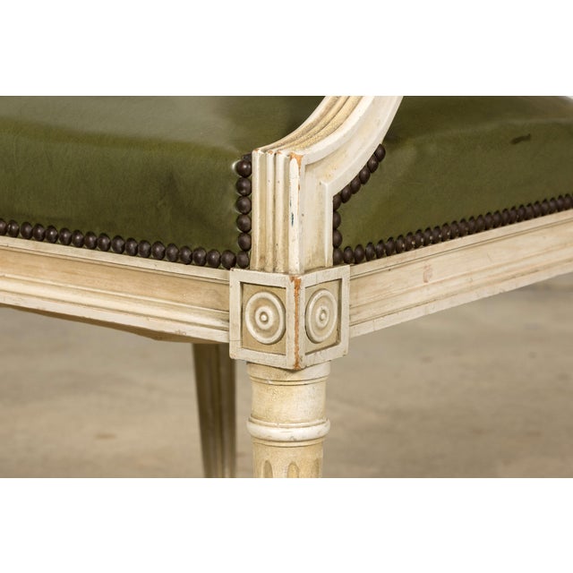 Elegant early 20th century French Louis XVI style armchair, sourced in Provence, France. The carved wood frame features an...