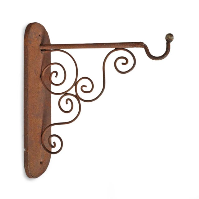 Beautiful hand crafted iron scroll design vintage wall bracket with rusted finish. Perfect for hanging lights or plants...