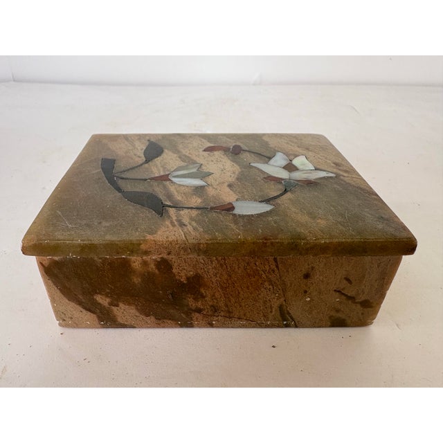 This vintage handcrafted trinket box from India is carved from solid natural marble and decorated with a delicate floral...