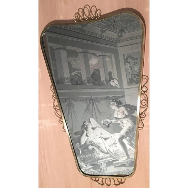 Adorable composition in the style of the great Italian designer. The mirror is 86 cm high and 49 cm wide at the top and 29...