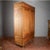 This imposing two-door wardrobe, crafted entirely from fir, is a masterful example of period furniture with a simple yet...