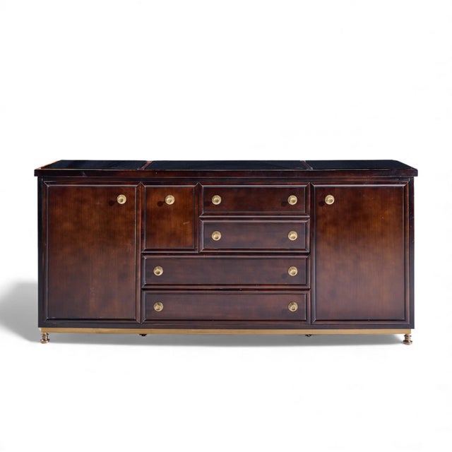 Laura Kirar for Baker Dansu Walnut and Brass Credenza This credenza measures: 78.5 wide x 22 deep x 36.25 inches high...