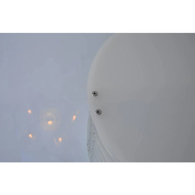 Cylinder acrylic coffee table. Base is made of alternate frosted and clear cylinder acrylic pieces. Top of table is also...