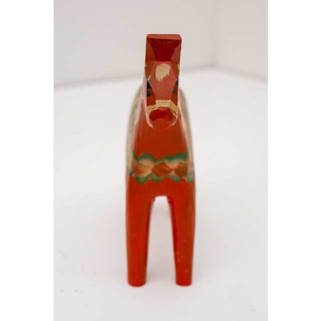 An authentic hand-carved dala horse by grannas a olsson, produced in the 1950s in the village of nusnäs, the historic...