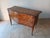 Elegant two-drawer chest of drawers inlaid in walnut. The top, front, and apron are curved in the Louis XV style, but the...