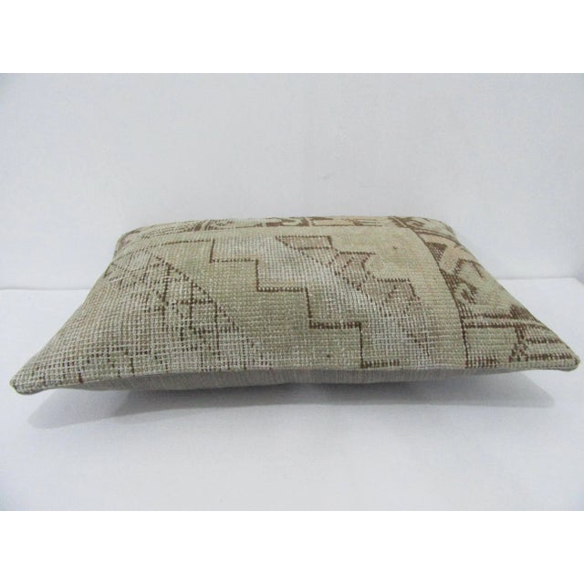 Decorative pillow cover made from a vintage Turkish handknotted rug. Backed with good quality cotton fabric. Pillow...