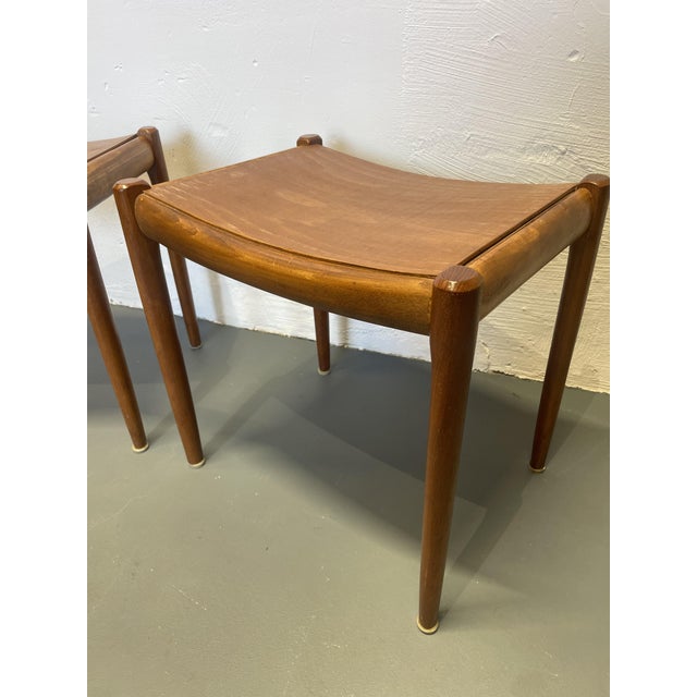 These two teak stools have had their original, damaged wickerwork replaced with a plywood panel. Therefore, they are ready...