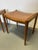 These two teak stools have had their original, damaged wickerwork replaced with a plywood panel. Therefore, they are ready...