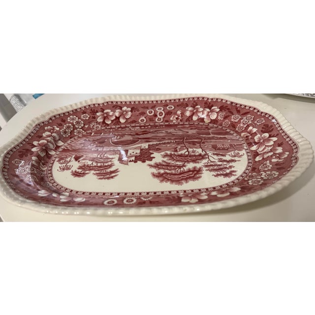 Authentic late 19th-century English ironstone oval platter by Copeland Spode, decorated in a rich red scenic transferware...