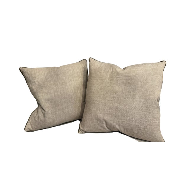 Decorative accent pillows featuring a textured chevron pattern in warm neutrals and soft metallic-inspired tones. Finished...