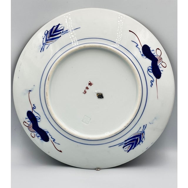 An antique, early 20th-century Japanese extra large plate, platter or charger, with traditional gold, cobalt blue, rust...