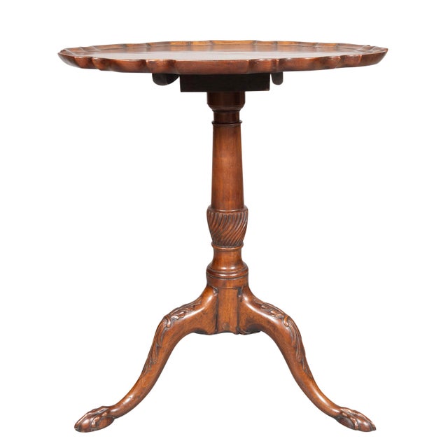 Circular hinged top with pie crust edge mounted on a turned support with fluted spiral urn and three cabriole legs with...