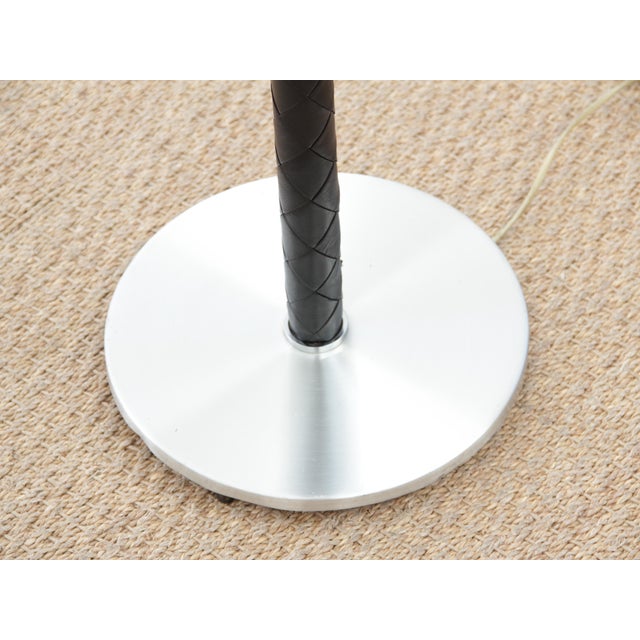 Scandinavian floor lamp by Jo Hammerborg. Feet sheathed in braided black leather. Electrical system renovated and brought...