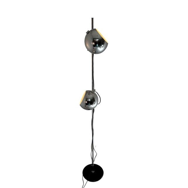 Vintage floor lamp made by the Dutch company GEPO. Period correct chrome shades and black base with a chromed upright...
