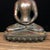This is a serene and beautifully patinated Chinese bronze figure of Shakyamuni Buddha. The Buddha is seated in the...