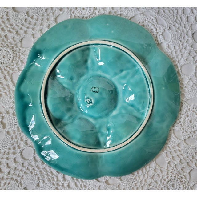 A gorgeous Mid-Century French Gien turquoise aqua blue-green glazed oyster plate, fluted at the edges. Circa 1950 with...
