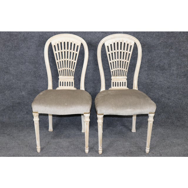 Representing the pinnacle of mid-century European luxury and design, this exceptional set of eight signed Maison Jansen...