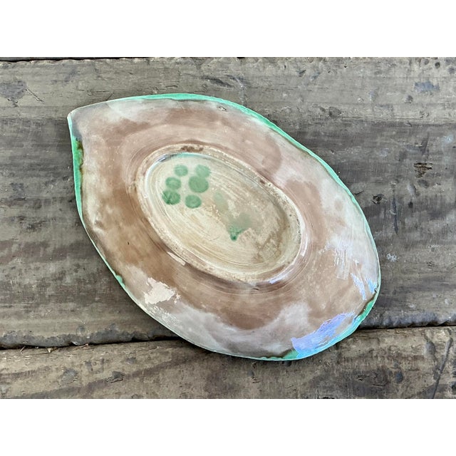 This exquisite vintage English Majolica plate is a testament to the enduring appeal of botanical design. Crafted with...