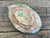 This exquisite vintage English Majolica plate is a testament to the enduring appeal of botanical design. Crafted with...