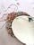 Vintage Barbola Mirror. An oval frame of wood. A diverse array of colors, Reds, pinks,yellow and blues adorn the mirror's...
