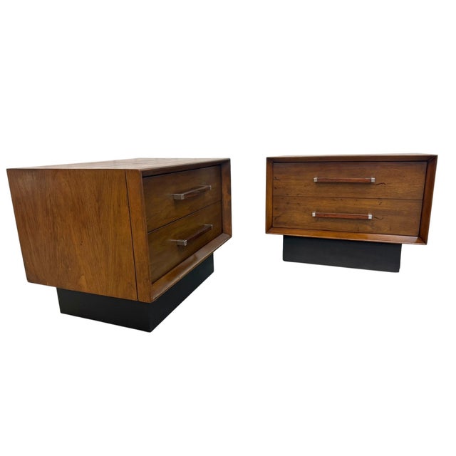 Elevate your bedroom with this exceptional pair of Mid-Century Modern Lane walnut and rosewood nightstands, crafted in the...