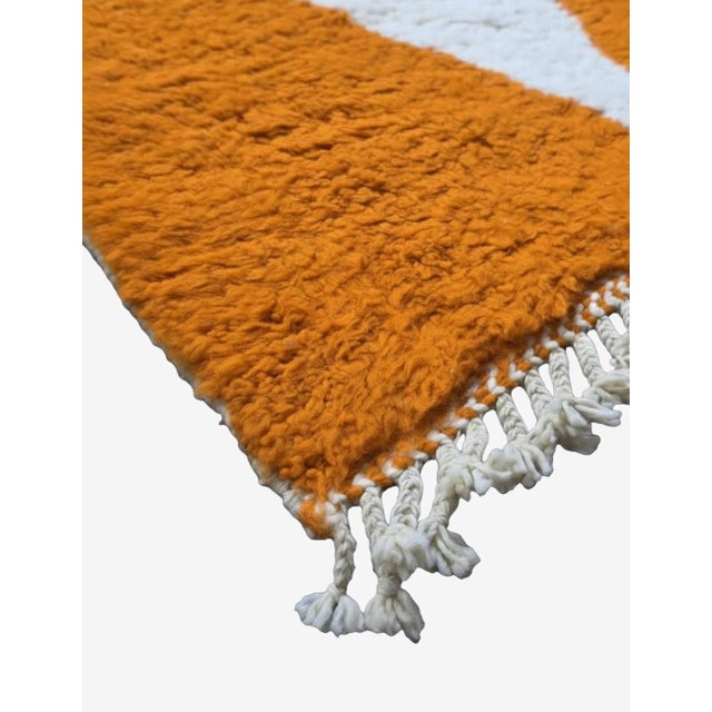 Burnt Orange Moroccan Rug – Handmade Berber Wool Carpet This bold handmade Moroccan rug features a rich burnt orange wool...