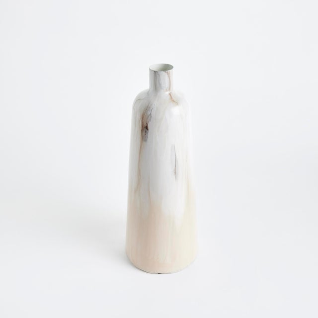 In a clever use of enameled iron, this lightweight decorative vase is painted by hand. With aCreamy mocha palette inspired...