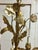 Illuminate your space with the timeless elegance of this vintage 16-light Italian gilded tole and cream enamel floral...