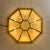 Beautiful octagon-shaped flush-mount light in full brass and cut-glass assembled as tiffany stained glass. Designed in...