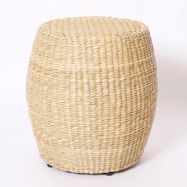 Unusual pair of garden seats hand crafted with a durable metal frame wrapped with reed in classic form.