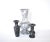 A set of three vintage carved stone marble vases, in classic baluster shapes in light gray and dark gray with mottled...