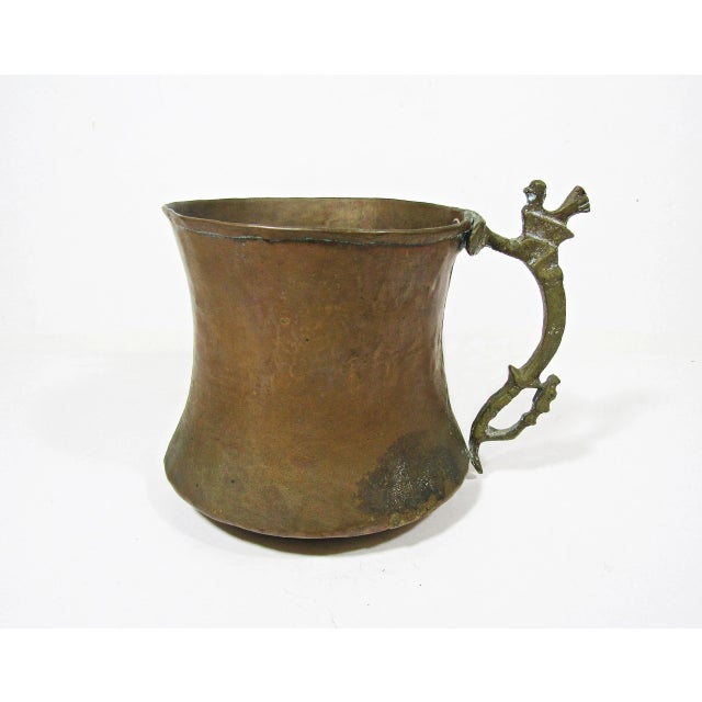 This antique hammered copper pitcher exudes rustic charm with its unique brass chicken handle. Handcrafted and full of...