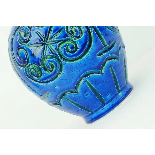 Italian mid century vase with relief surface in different shades of blue, turquoise and green. Marked to bottom with model...