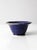 This vintage handmade studio pottery bowl features a deep blue glaze with natural tonal variation across the surface,...