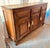 Rare hand-carved basket weave motif with perforation, paneled doors, three interior cutlery drawers lined with grey felt,...