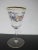 Very sweet vintage cordial or aperitif glass. Clear glass with hand painted colorful floral and bow design. Rim has gold...