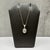 This aquamarine and diamond pendant necklace is crafted in 10kt yellow gold and features a beautiful 6.9 x 4.9mm oval cut...