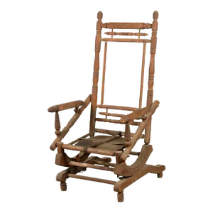 Rustic 19th Century Indian Rocking Chair with Metal Accents and Turned Supports