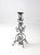 This vintage iron candle stand features an elegant open scrollwork design and a tall, sculptural silhouette that makes a...