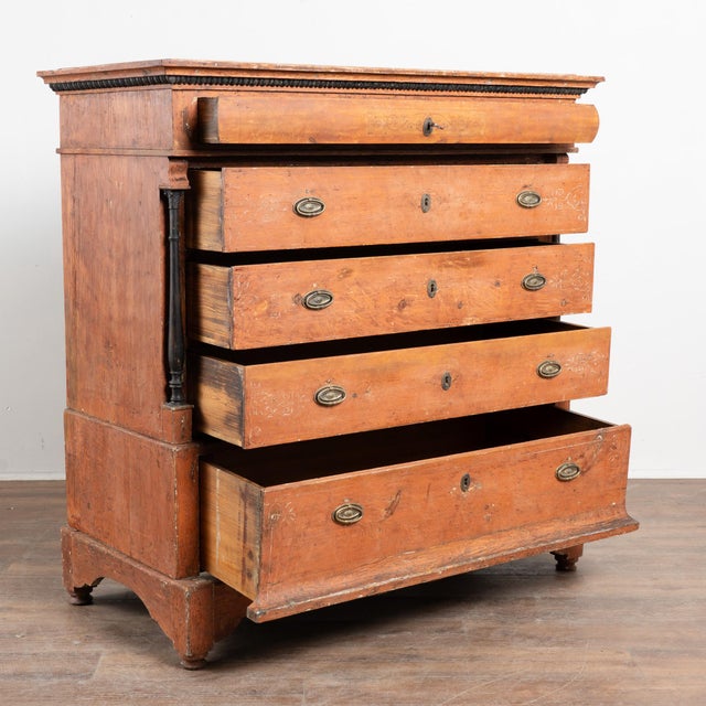 Early 19th-century Danish pine chest of five drawers retaining its original brick red painted finish. The chest is...