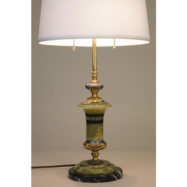 A sophisticated and elaborately detailed Green & Black Banded Onyx Marble & Bronze/Brass Neoclassic French Empire table...